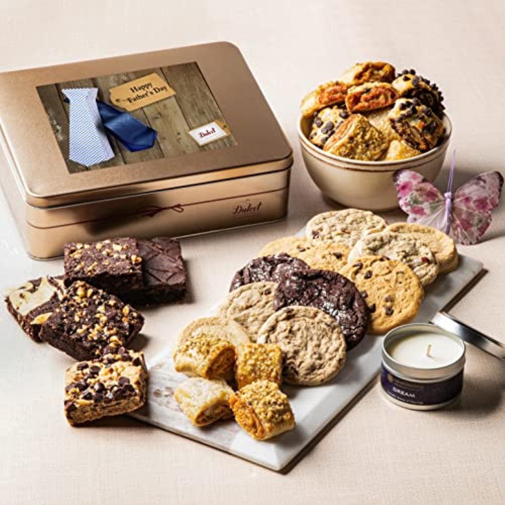 Gift tin treats on plates: brownies, cookies, rugelach, and small candle