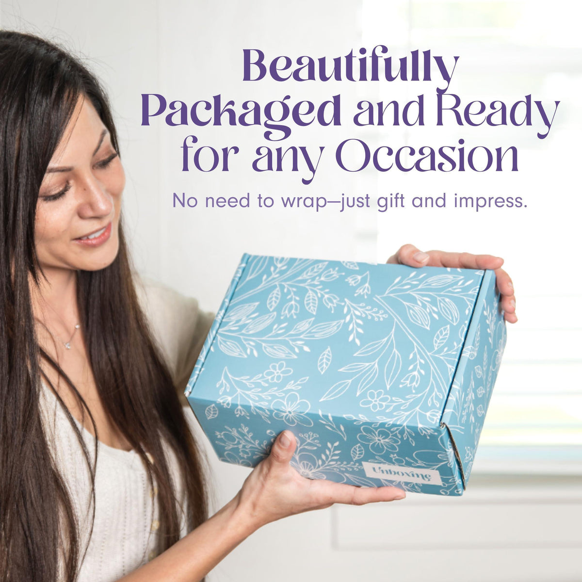 Blue floral lavender gift box held by a woman