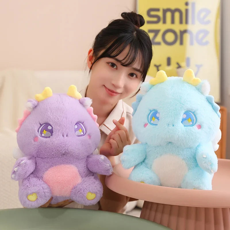 Blue and purple baby dragon plushies with star-eye embroidery and yellow horn tips