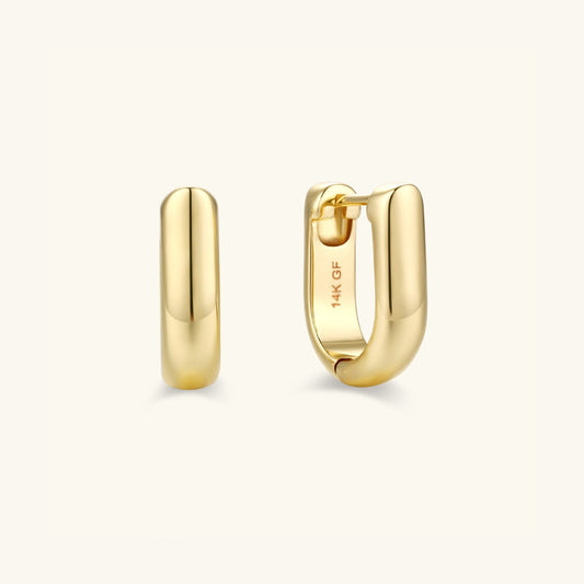 Gold oval hoop earrings with hinged clasp, pair shown