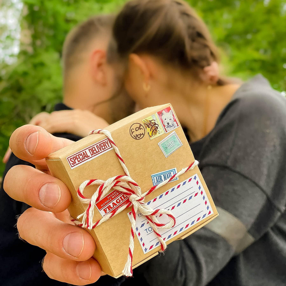 Ribbon-tied kraft gift box with “Fragile” label and “Special Delivery” stamp-style marks