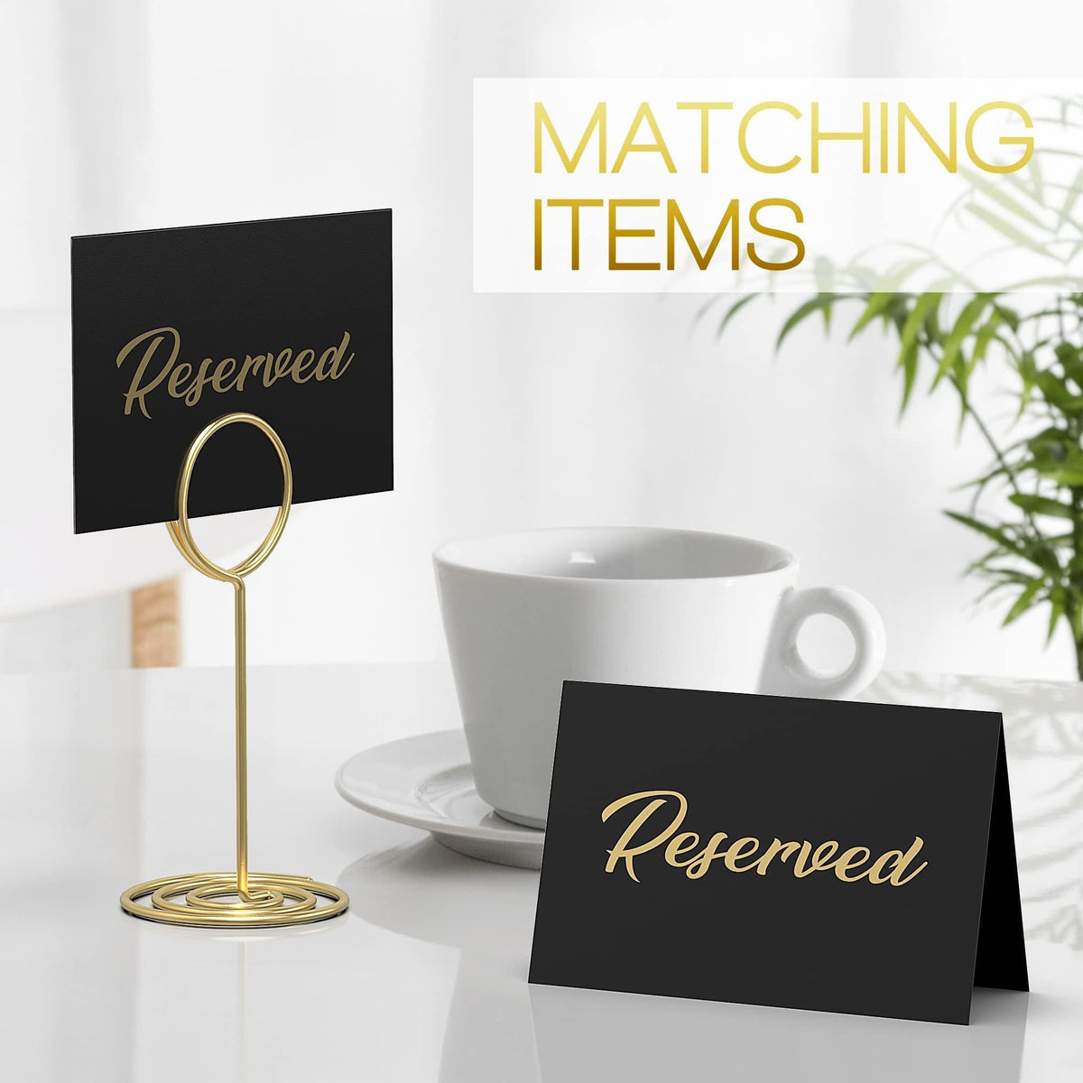 Black tent sign with gold-foil “Reserved” on a matching tabletop stand
