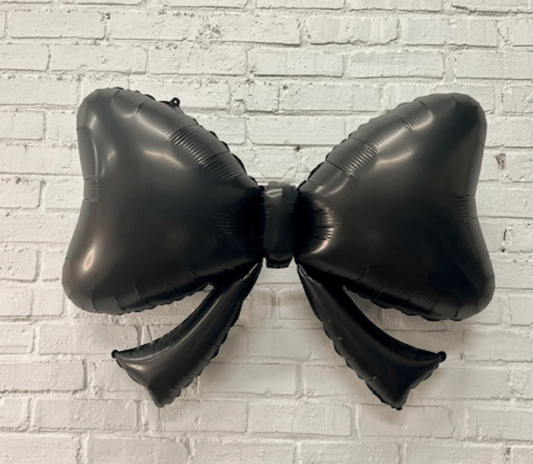 Black bow-shaped foil balloon, 40 inch, with small dangling balloon pieces