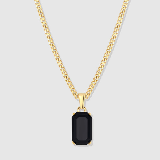 Gold-tone chain pendant with black rectangular onyx-style stone centerpiece.