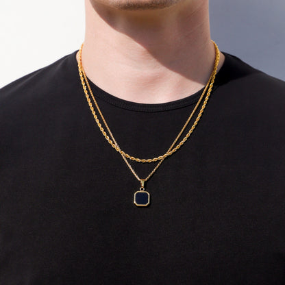 Gold chain necklace with square black onyx pendant, layered double-strand look