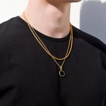 Gold chain necklace with square black onyx pendant, double-strand layering