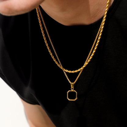Gold layered chain necklace with square black onyx pendant centerpiece