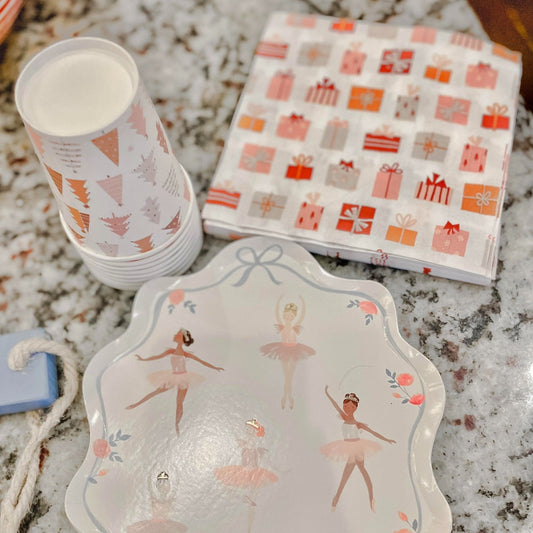 Stack of Christmas-themed paper cups with tree, ornament, and candy icons