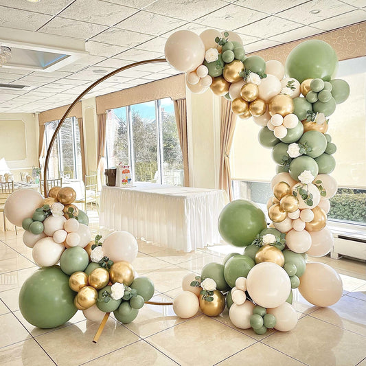 Balloon garland arch with sage green, gold and cream balloons plus greenery and flowers
