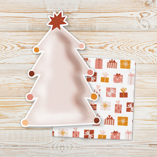 Pink Christmas tree-shaped paper plate with white scalloped edge and hanging bauble dots