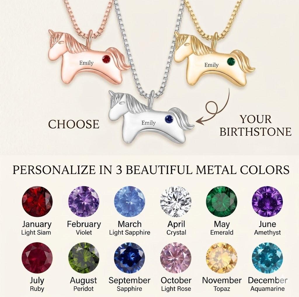Three unicorn pendant birthstone necklaces on chains: red, green, purple stones