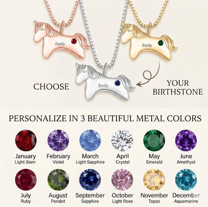 Three unicorn pendant birthstone necklaces on chains: red, green, purple stones