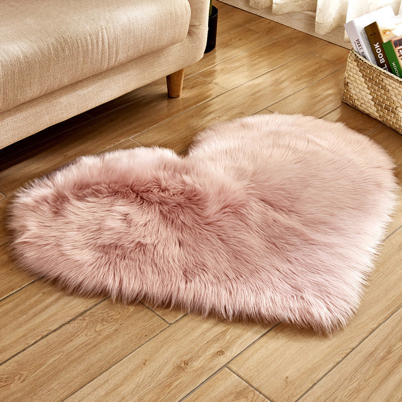 Light pink heart-shaped faux fur rug with shaggy plush pile