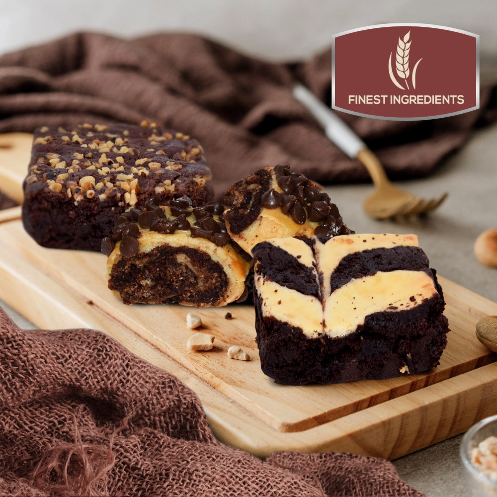 Assorted brownie and cookie slices on a wooden serving board