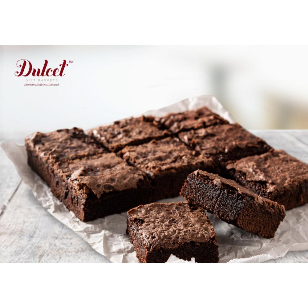 Chocolate brownie cookie sampler pieces on parchment-lined tray