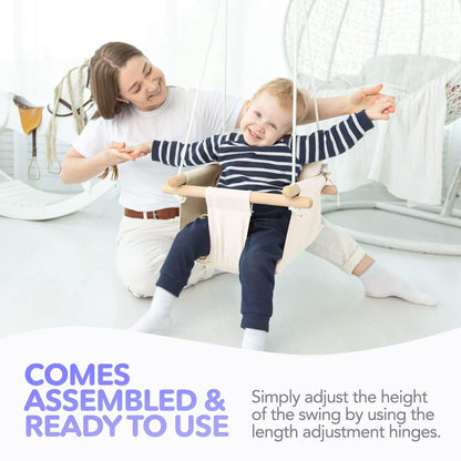 White canvas baby hanging swing with wooden dowels, child and toddler playing