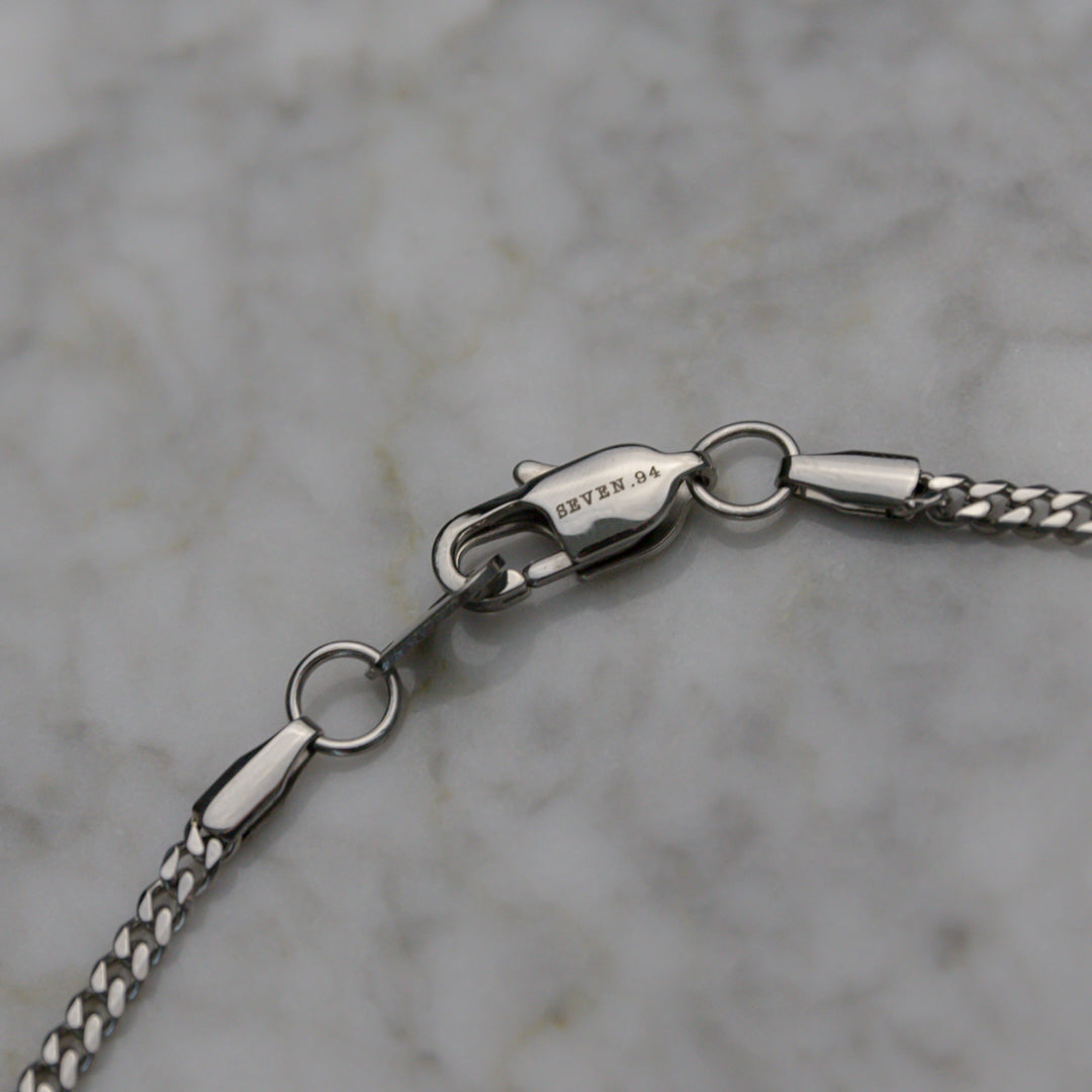 Miami Cuban link chain necklace clasp and connector detail in silver-tone