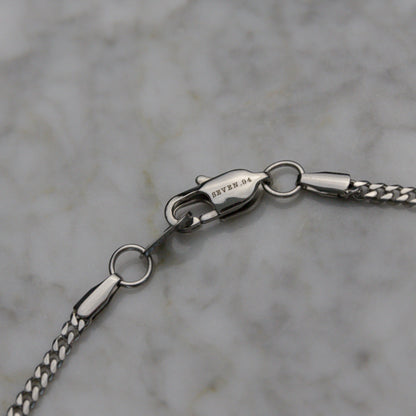 Miami Cuban link chain necklace clasp and connector detail in silver-tone