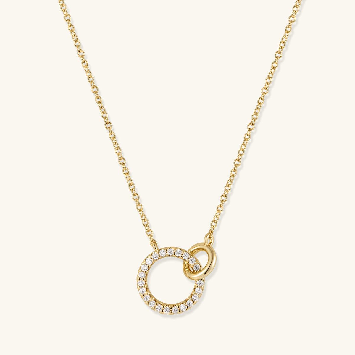 Gold-plated necklace with pavé open circle pendant and small interlocking ring