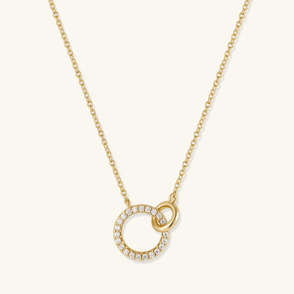 Gold-plated necklace with pavé open circle pendant and small interlocking ring