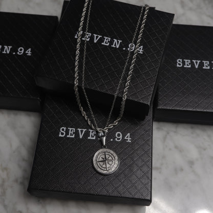 Silver compass pendant necklace set in black gift bags