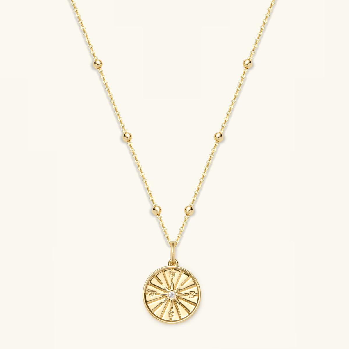 Gold filled compass pendant necklace with round compass medallion on chain