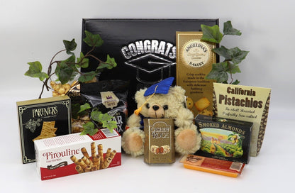 Graduation gift box with plush teddy in blue cap and assorted nut and snack bags