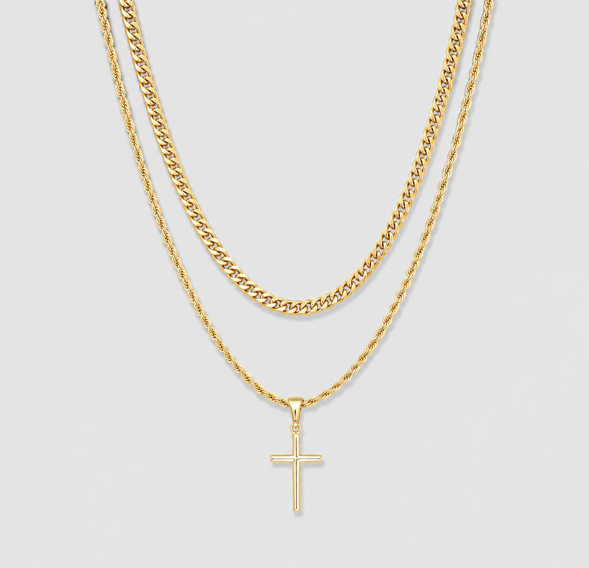 Gold small cross necklace set with two layered chain lengths and cross pendant