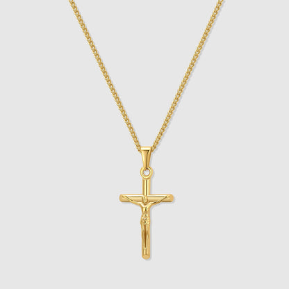Gold crucifix pendant necklace with curb chain and circular jump ring
