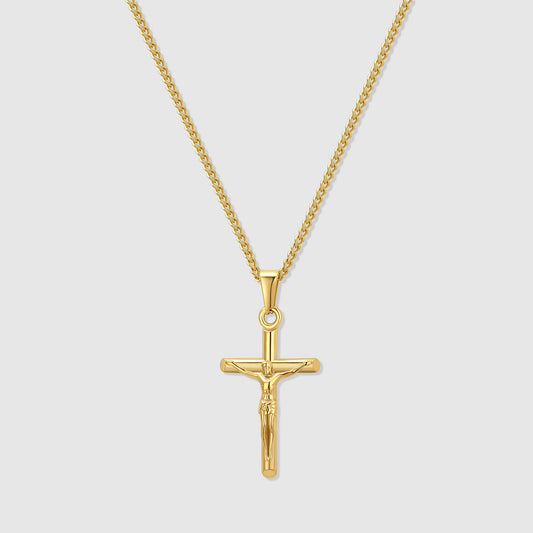 Gold crucifix pendant necklace with curb chain and circular jump ring