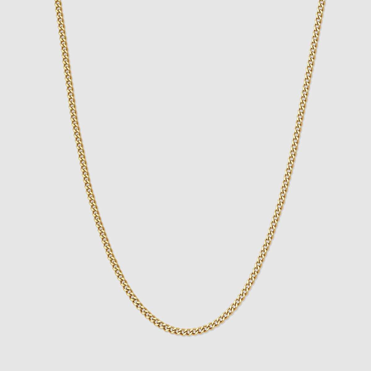 Gold Cuban link chain necklace with interlocking oval links, close-up view.