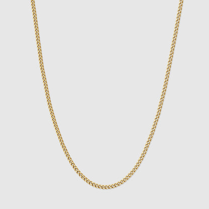 Gold Cuban link chain necklace with interlocking oval links, close-up view.