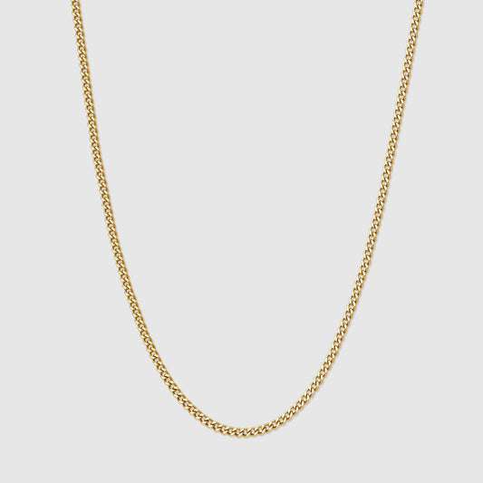 Gold Cuban link chain necklace with interlocking oval links, close-up view.