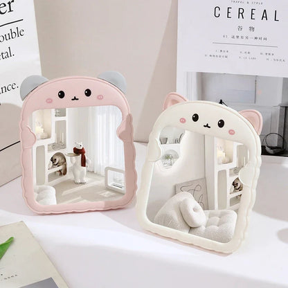 Pink animal-shaped desktop mirror with cute face design and arched frame