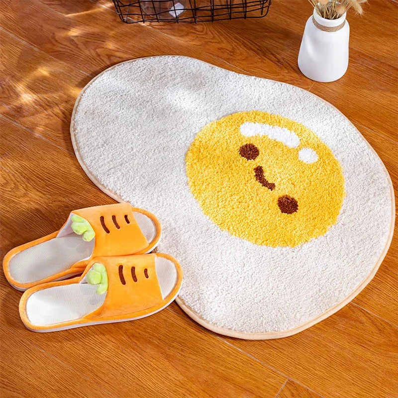 Cute egg bathroom rug with yellow egg-face print and rounded oval outline