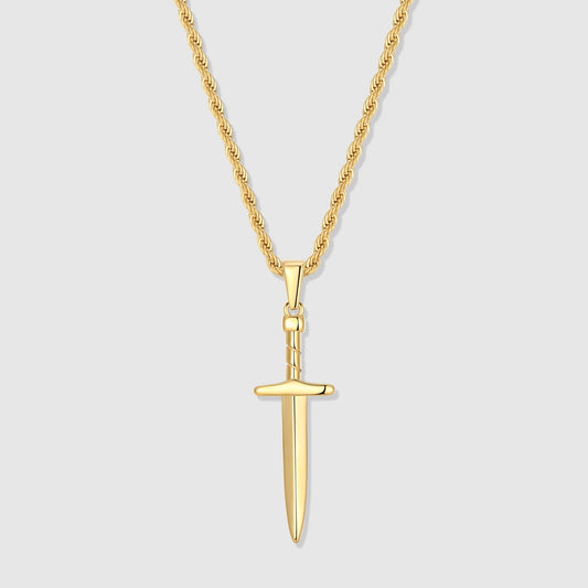 Gold dagger pendant necklace with elongated sword-style charm on chain