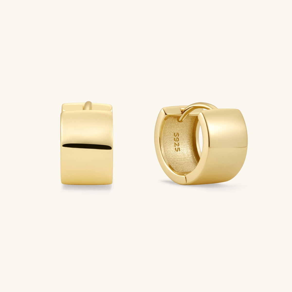 Gold small hoop earrings with smooth, squared outer edge and black inset detail