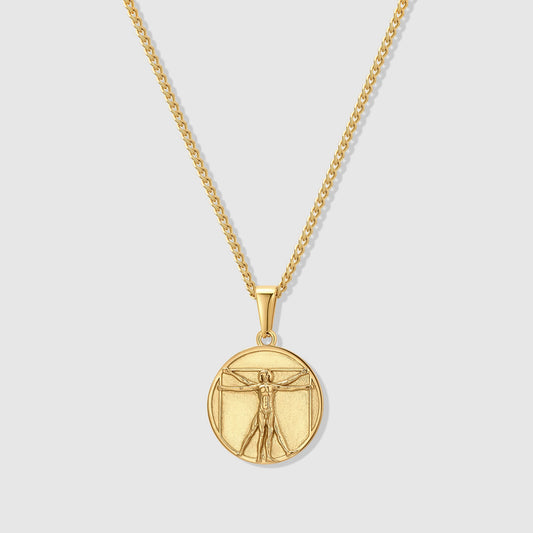 Gold-tone round pendant necklace with engraved Vitruvian Man design and chain