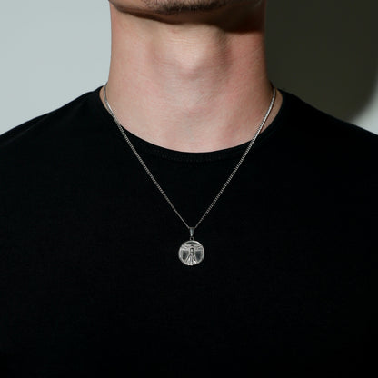 Silver-tone double-layer necklace with round pendant centerpiece and linked chain