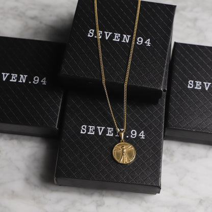 Necklace set in gift boxes with gold-tone chain and circular medallion pendant