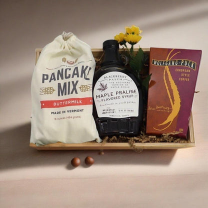 Breakfast gift crate with pancake mix bag, maple praline syrup, and European style coffee