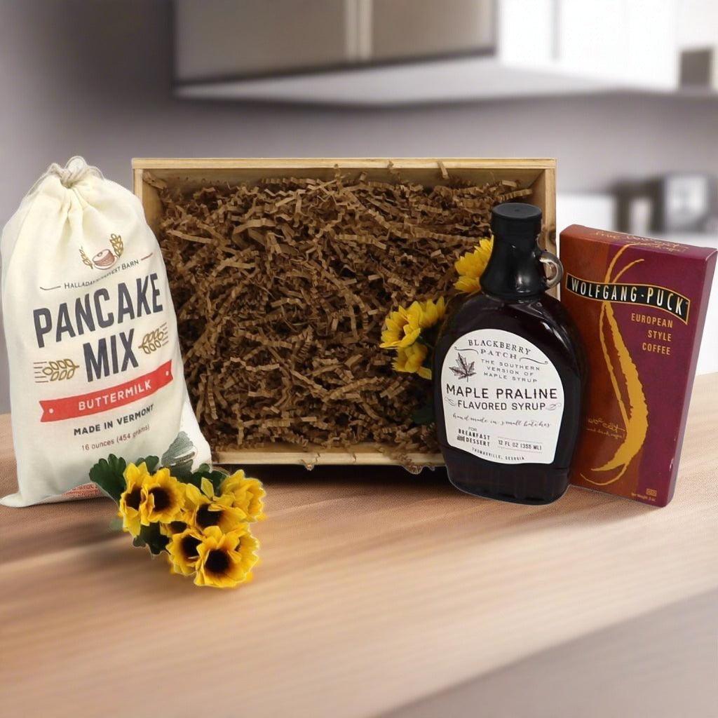 Breakfast gift crate with pancake mix bag, maple syrup bottle, and coffee box