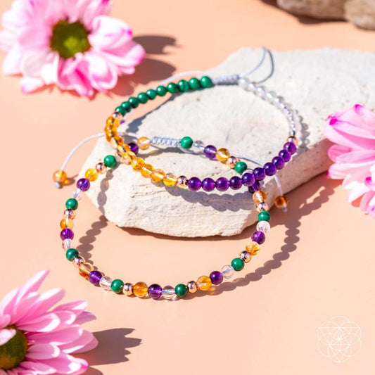 Triple beaded anklet set with green, purple, orange, and gold glass beads on cords