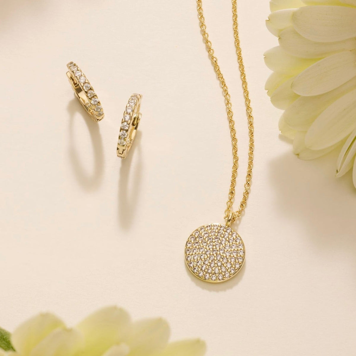 Pavé disc necklace with gold-tone chain and round crystal-studded pendant