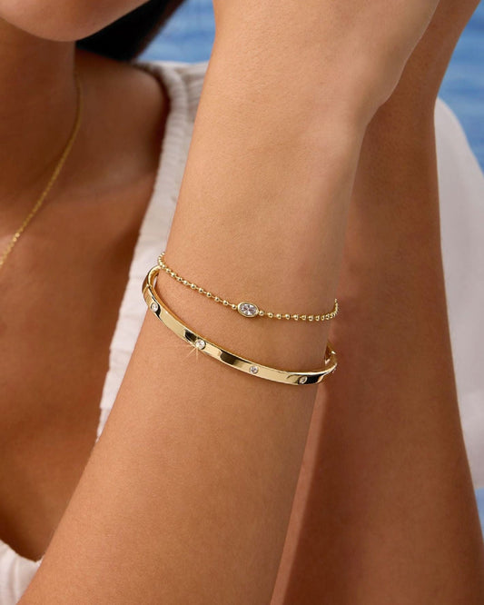 Gold filled bracelet with oval stones and a small diamond accent