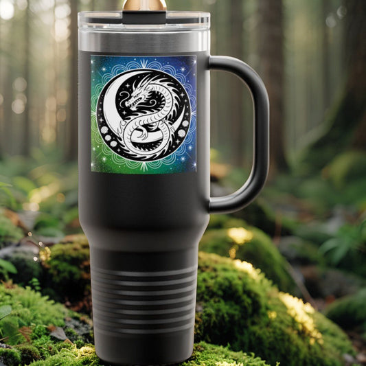 Insulated travel mug in matte black with dragon graphic and clear lid with straw