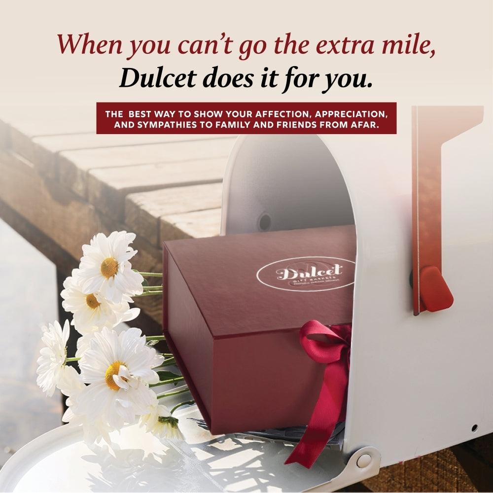 Gift box with red ribbon and Dulcet logo on the lid