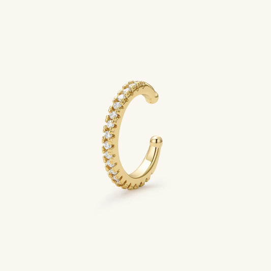 Gold ear cuff with clear stones along one side