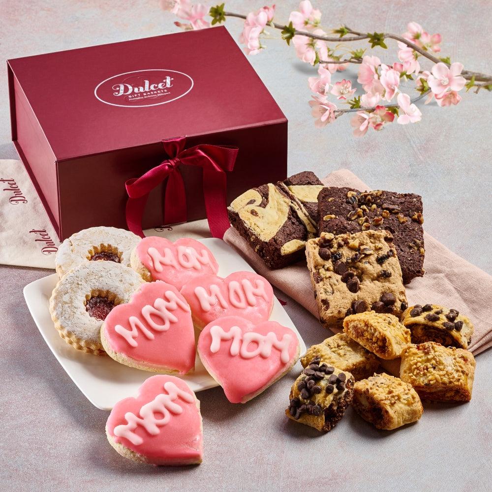 Mother heart cookies, mixed brownies, and gift box with ribbon in a care package