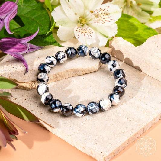Orca agate beaded bracelet with dark navy and white speckled round beads